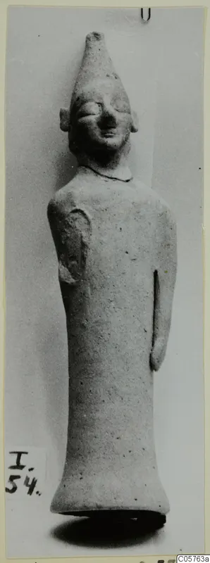 Terracotta figurine of a standing figure with a tall conical headdress, from Ayia Irini