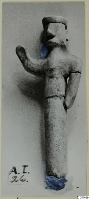 Terracotta statuette of a standing figure with one arm raised, from Ayia Irini