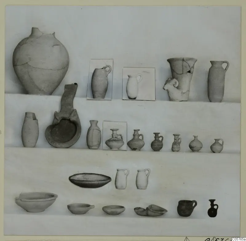 Group of pottery vessels from Ayia Irini, Pottery of Period 6, arranged in rows of jars, jugs and bowls