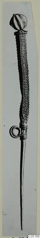 Long pin with a ribbed ball head, a braided shaft and a coiled wire loop near the lower end.