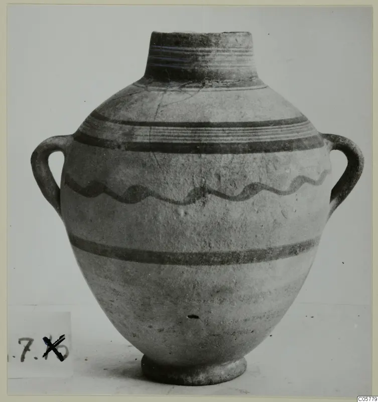 Pottery White Painted IV amphora from Amathus, two-handled, with dark painted bands and a wavy line