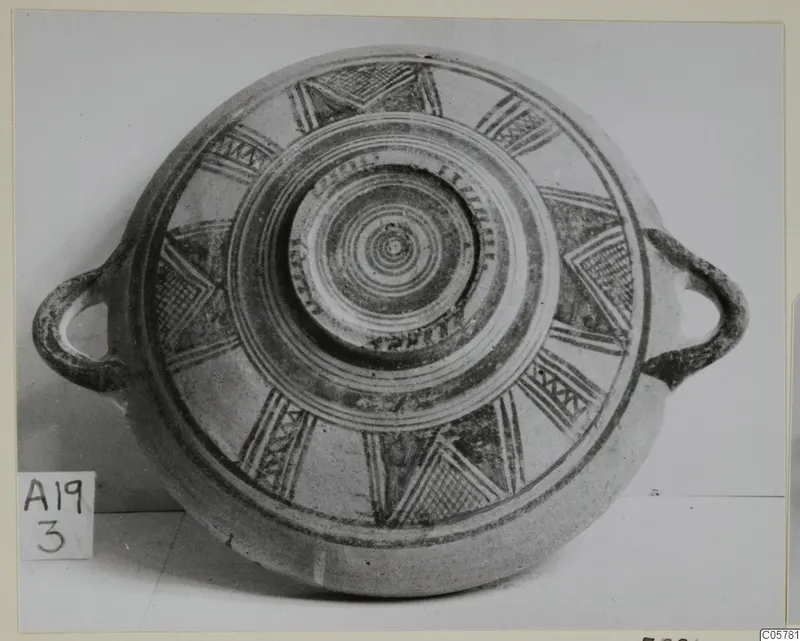 Pottery Bichrome II bowl from Amathus, seen from above, with two loop handles and dark-painted radiating motifs