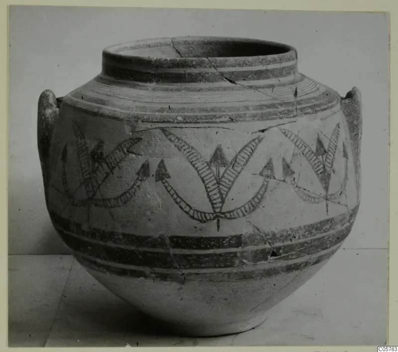 Painted pottery jar with two handles, dark bands and hatched wavy motifs around the body, from Amathus.