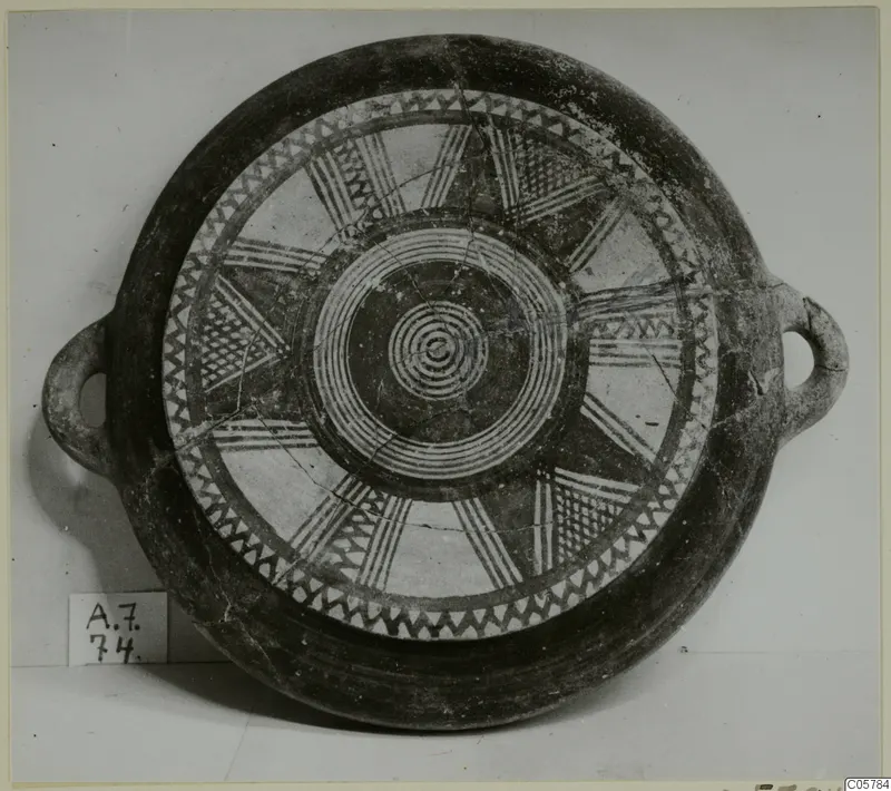 Pottery Black Slip Bichrome bowl with two loop handles, seen from above