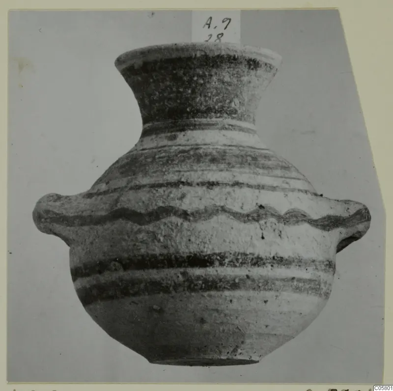 Painted pottery amphora-crater from Amathus with a flared neck and two side handles, photographed against a grey backdrop
