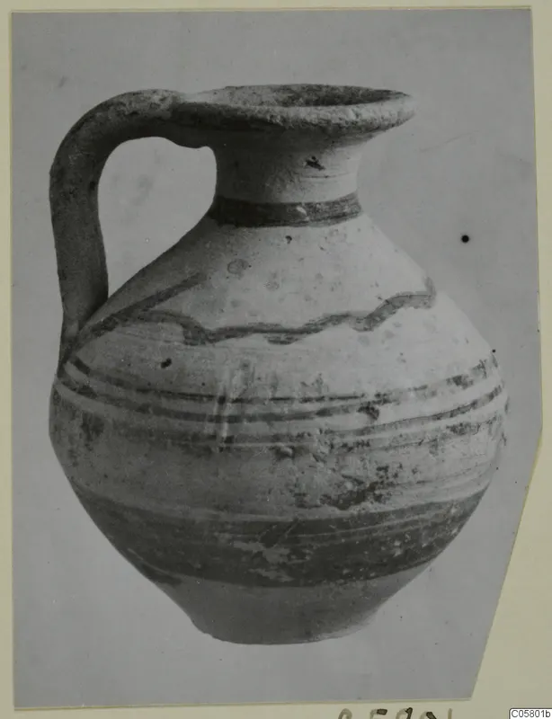 Pottery Bichrome IV jug from Marion, with a strap handle, flared mouth and painted bands