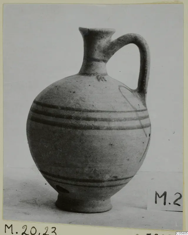 Pottery White Painted VI jug from Marion, with a single handle and dark painted bands