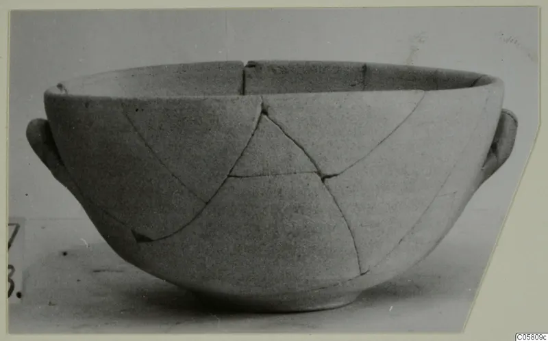 Plain White I-III bowl with two side handles, broken and mended.