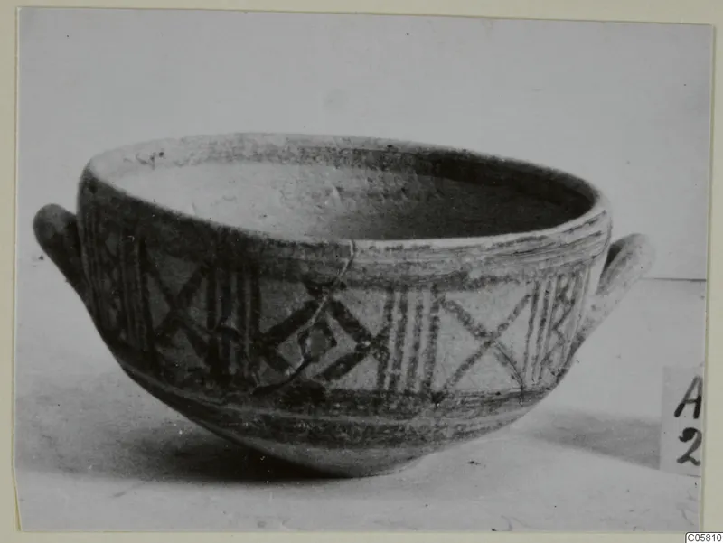 Pottery Bichrome II bowl with two small handles and dark painted bands and crossed-line panels
