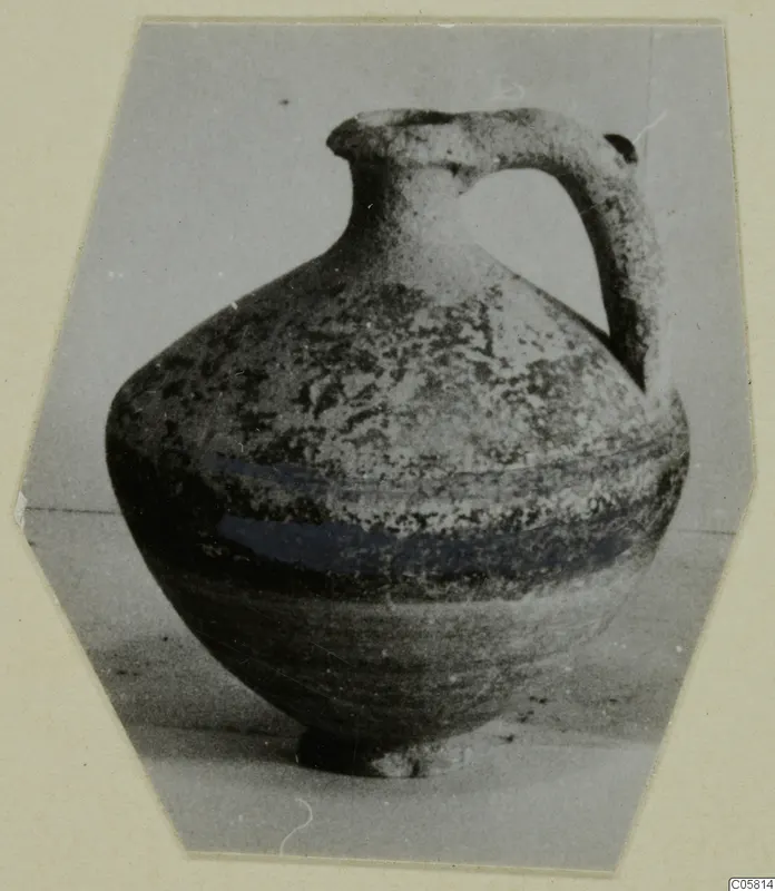 Jug with a single strap handle and a globular body, Pottery Black-on-Red II-IV
