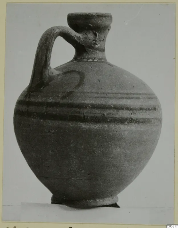 Pottery jug with a strap handle and two dark painted bands, from Marion