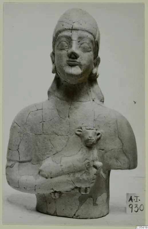 Terracotta Neo-Cypriote bust with a tall headdress and a small animal-like figure held against the chest
