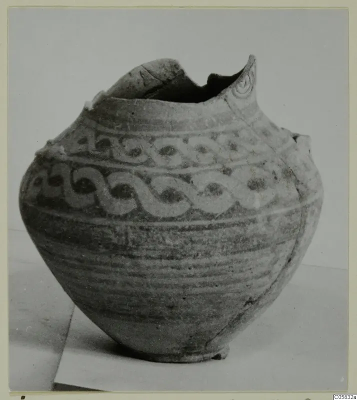 Pottery Bichrome IV amphora-crater (J.609) with a broken rim and bands of painted interlocking scroll decoration.