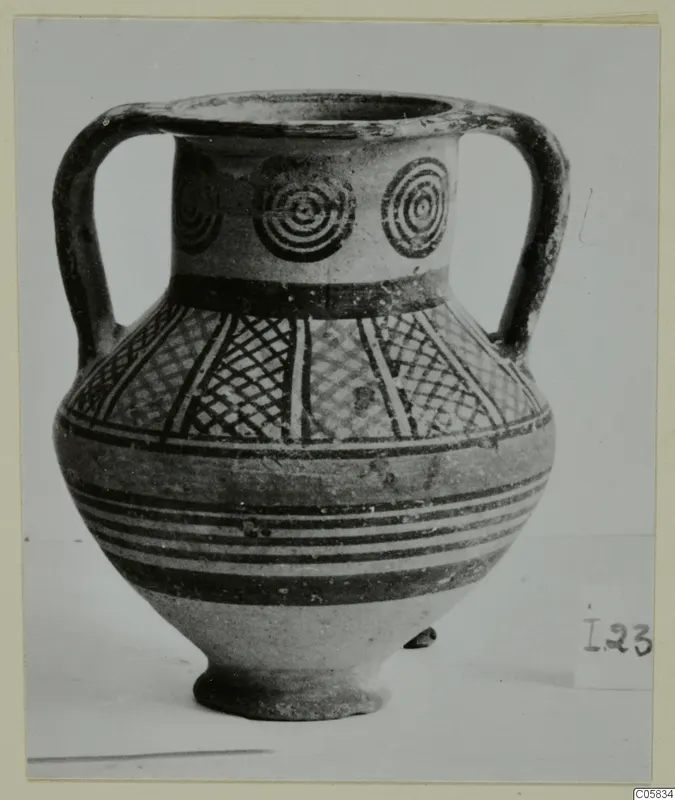 Two-handled jar with concentric circles on the neck and cross-hatched panels on the body, painted in dark bands