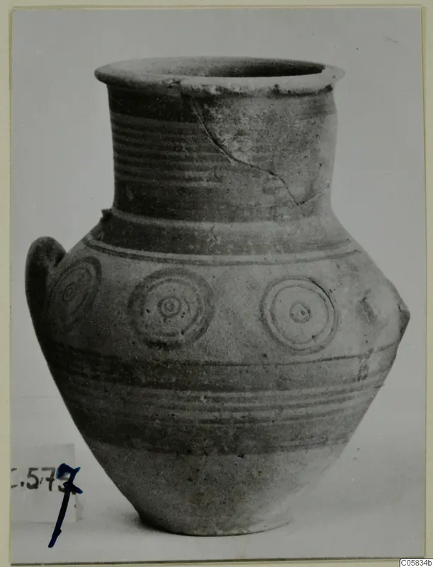 Pottery Bichrome V jar with a flared rim, banded body and concentric circle motifs