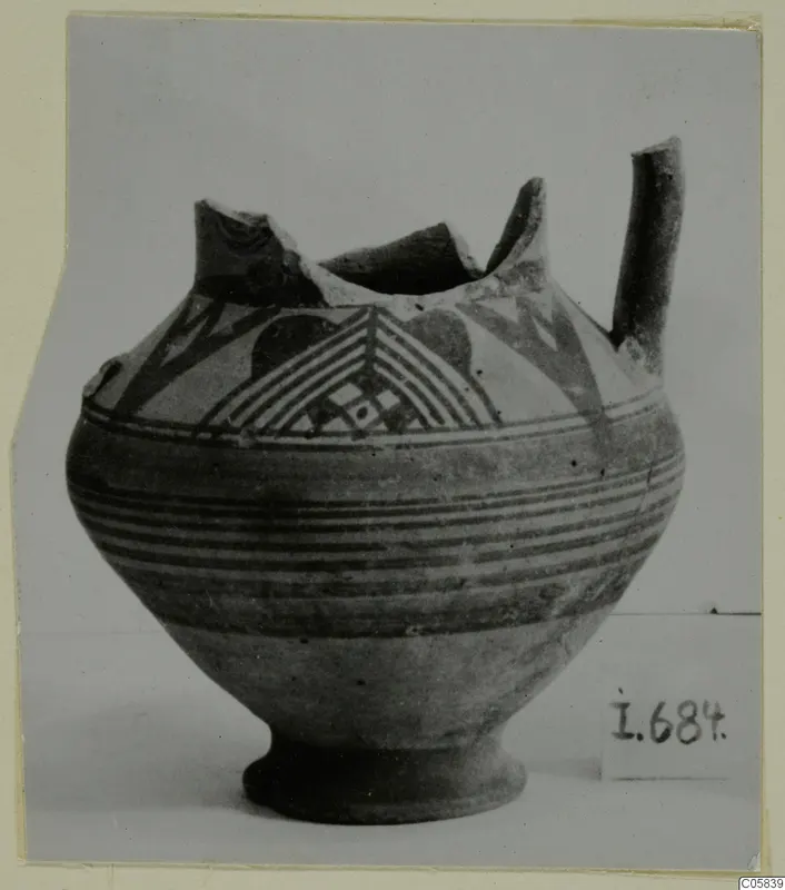 Pottery Bichrome IV vessel from Idalion with painted chevrons, bands and a side spout, rim broken