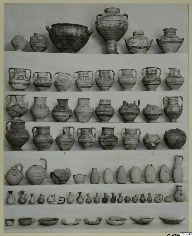 Pottery vessels from a deposit at Idalion, arranged in rows: bowls, two-handled jars, jugs and small juglets.
