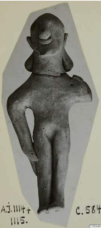 Terracotta figurine of a standing nude figure from Ayia Irini, with one arm broken off at the shoulder