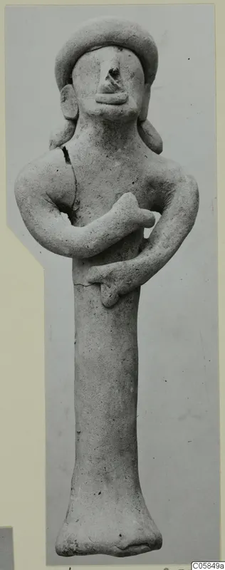 Terracotta figurine of a standing figure with arms folded across the chest, shown full length