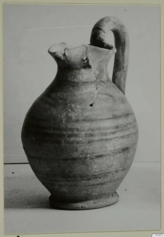 Pottery jug with a pinched mouth and tall loop handle, from Idalion.