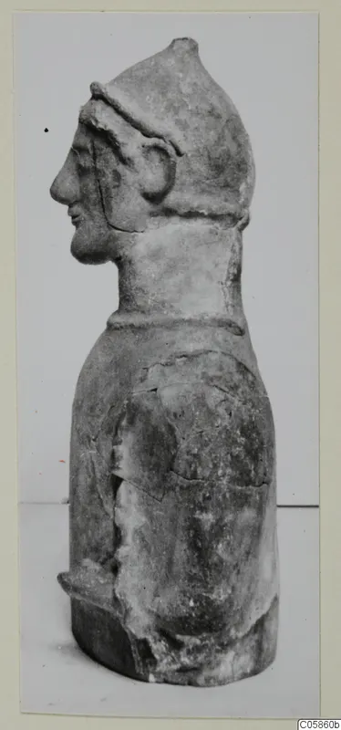 Terracotta figure of a helmeted man in profile facing left, from Mersinaki