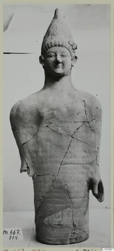 Terracotta statue of a standing figure with a tall conical headdress, broken and mended, from Mersinaki