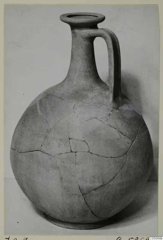 Globular jug with a tall neck and single strap handle, cracked and rejoined, from Idalion