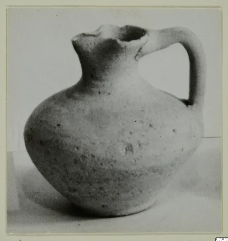 Cypro-Hell.I. jug with a single loop handle and a pinched, lipped mouth