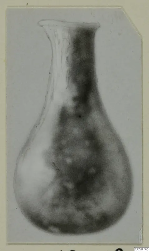 Blown glass vessel from Idalion with a flared rim, long narrow neck and rounded body