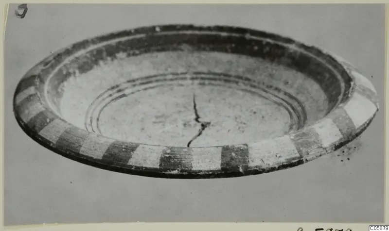 Pottery White Painted V bowl, shallow, with alternating dark and pale blocks around its outer wall