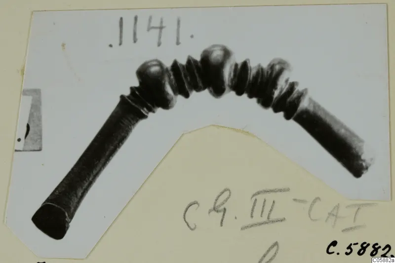 Bronze fibula with an arched bow of ribbed rings and knobs, from Idalion