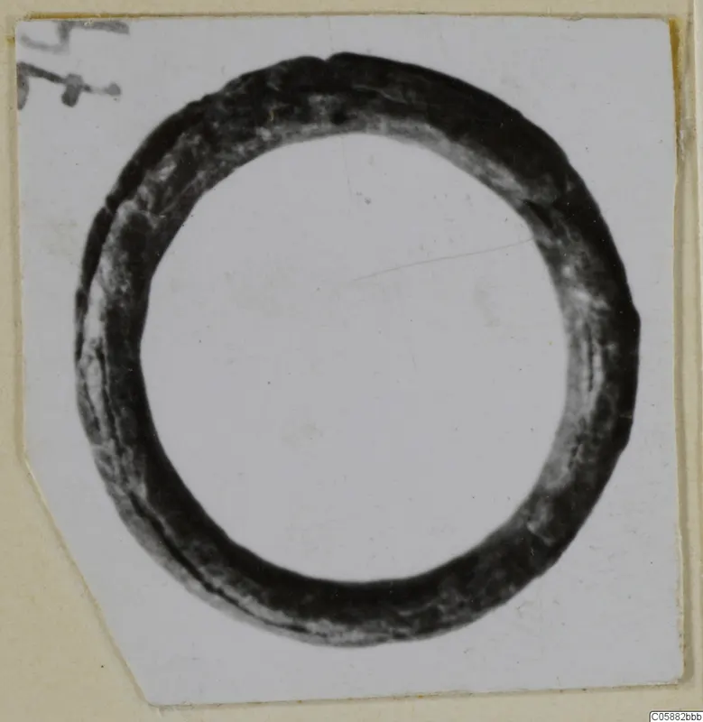 Bronze finger ring from Idalion, seen face on against a pale backdrop.