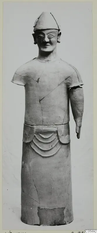 Terracotta standing figure, Proto-Cypriote I type, from Ayia Irini, with conical cap and arc-decorated lower body