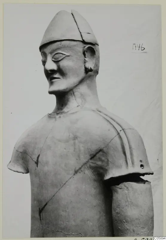 Terracotta statue of a figure in a conical cap, head and upper torso, one arm, from the Terracotta Proto-Cypriote I series