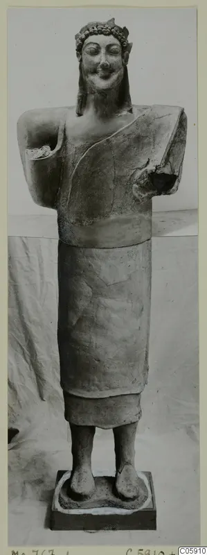 Terracotta Cypro-Greek statue from Mersinaki, a standing figure with a wreath-like headband and damaged arms.
