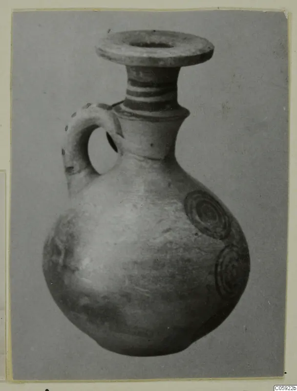 Jug, Pottery Bichrome IV, with a flared rim, banded neck and concentric circle motifs on the body