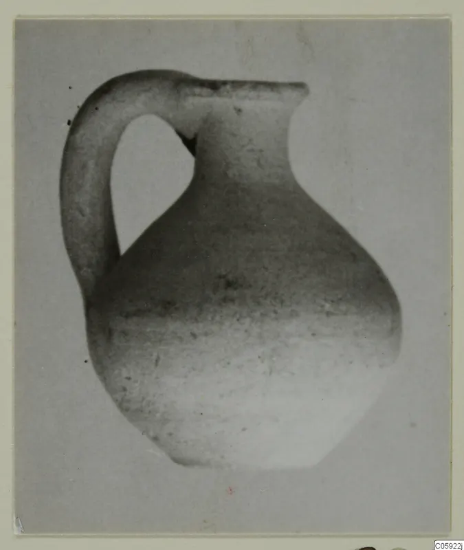 Pottery Plain White IV-V jug with a single strap handle, shown alone against a plain grey backdrop