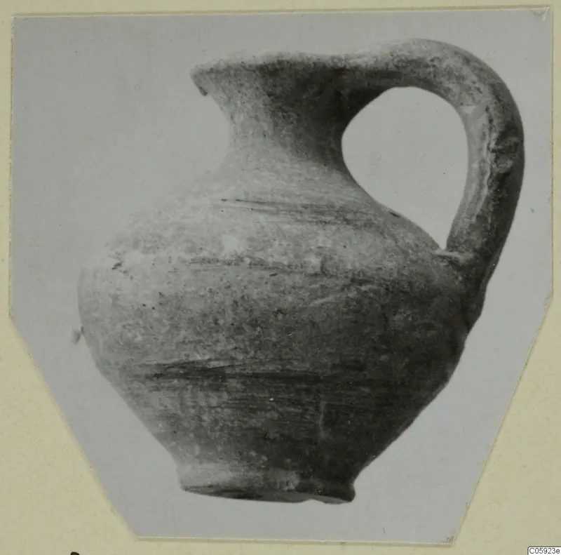 Pottery jug with a pinched spout and a tall loop handle, from Idalion