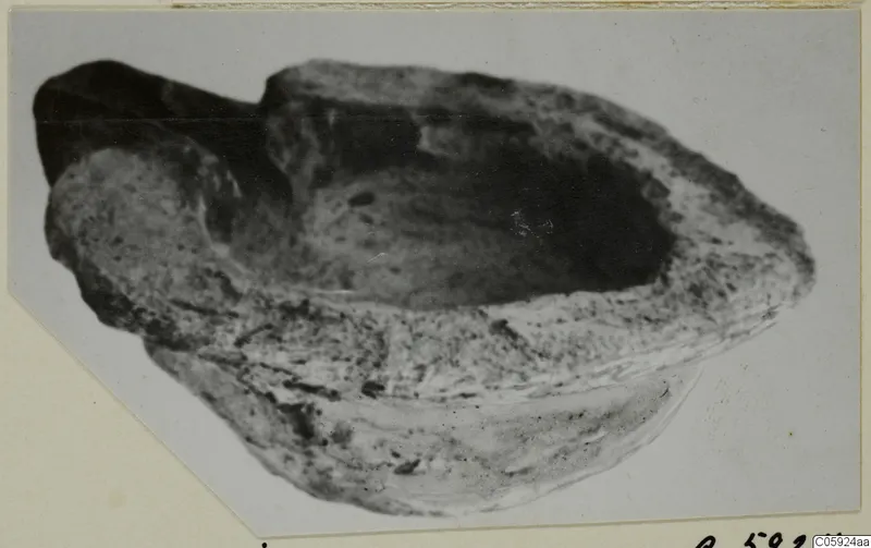 Terracotta lamp from Idalion, a shallow open bowl with a raised lip at one end.