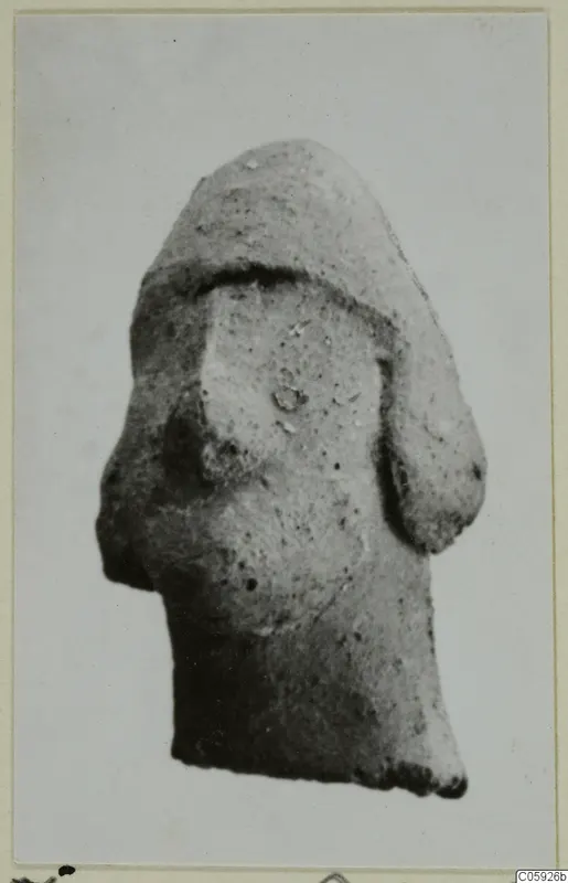 Terracotta figurine fragment from Idalion, broken at the base, with a rounded upper part