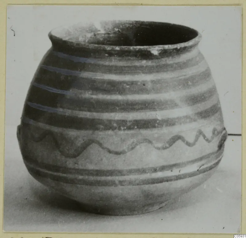 Bichrome-Red jar with horizontal painted bands and a wavy painted line on its body