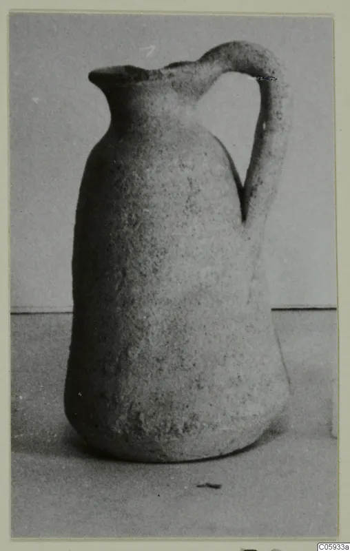 Plain White pottery jug with a single strap handle