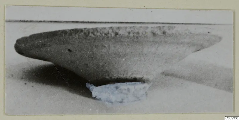 Plain White VII bowl photographed in side view on a pale surface