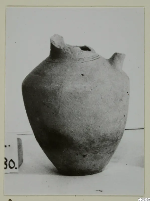 Jug of Plain White I-III pottery from Idalion, with a broken tall neck and a small spout on the right shoulder