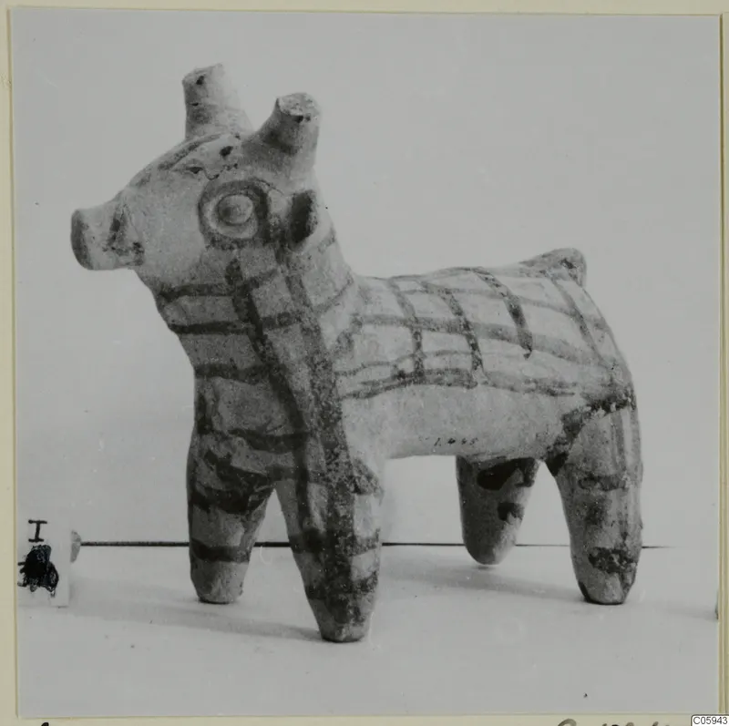 Terracotta figurine of a four-legged animal with dark painted bands, from Idalion