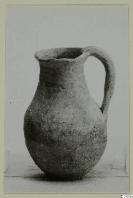 Plain White pottery jug with a wide mouth and a single handle, from Idalion