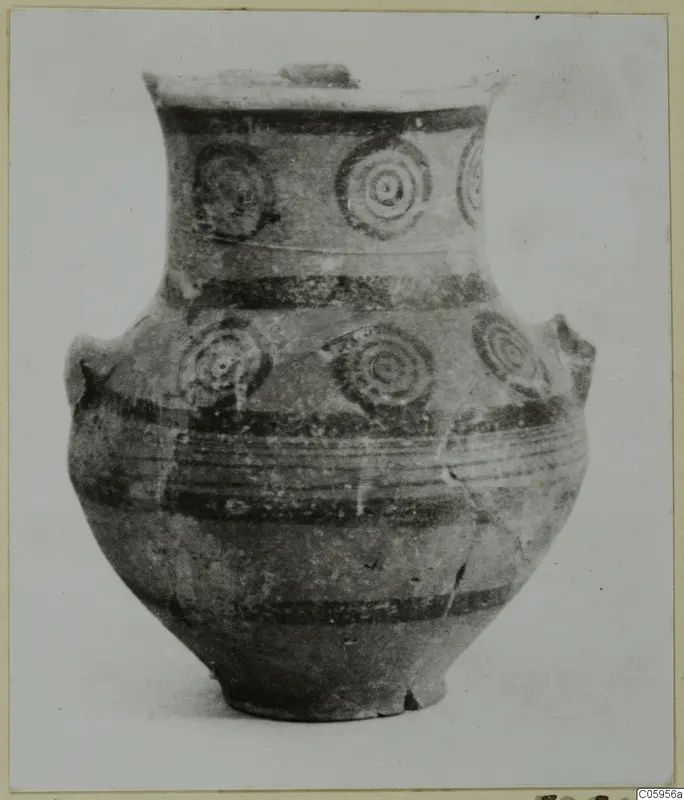 Pottery Black-on-Red II-IV jar with concentric circle motifs, horizontal bands and two handles