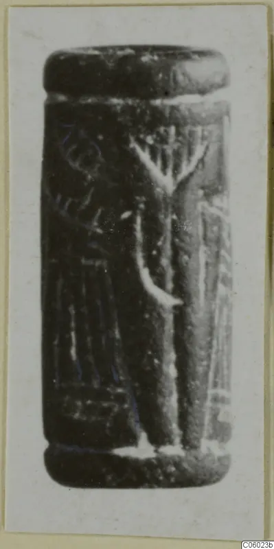 Cylinder seal from Idalion in dark stone, with an incised design of a branched motif and vertical lines