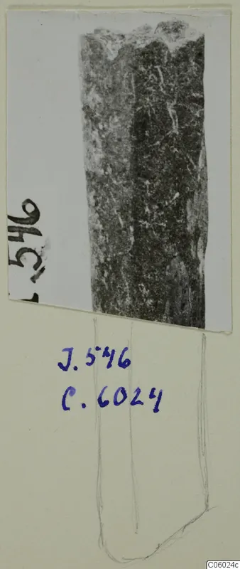 Small find J.546: a long, corroded object shown in a photograph mounted on a card