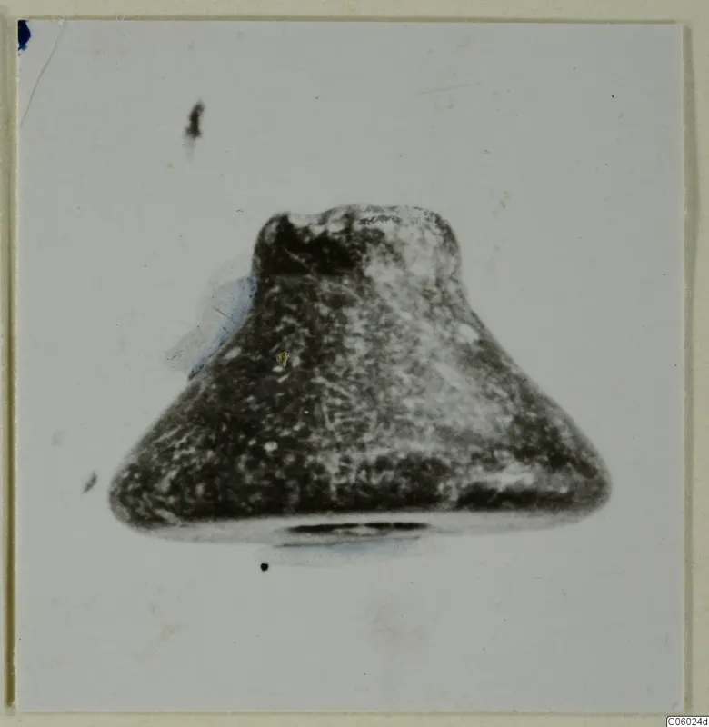 Small find from Idalion: a single object with a broad flat base tapering to a narrower top, on a pale background